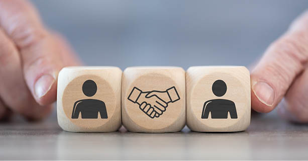 Concept of collaboration on wooden blocks