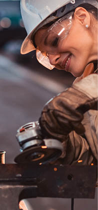 Beautiful woman working at heavy industry factory.